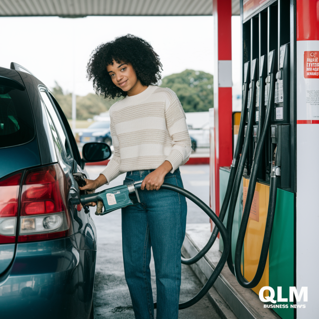 Woman filling up her car with petrol